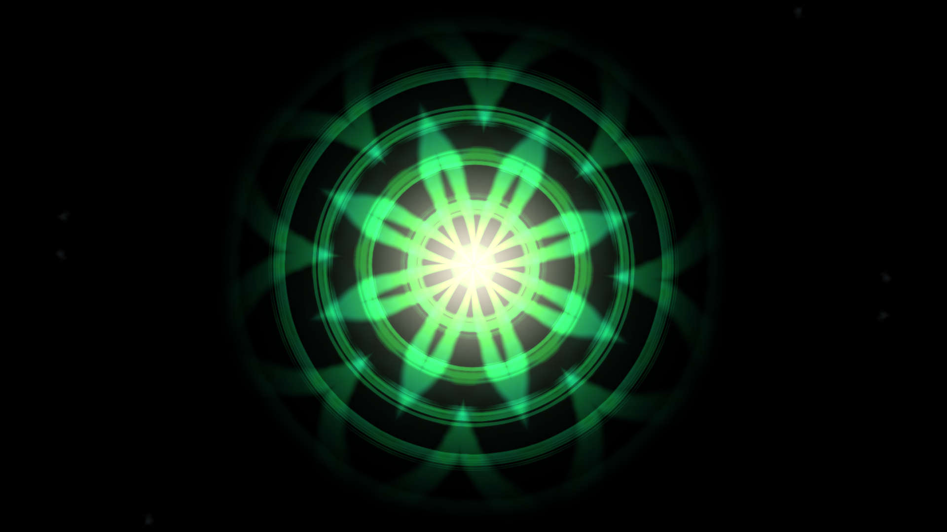 Audio visualizer mandala effect: green glowing kaleidoscopic flower shape with several rings and a bright centre on a black background
